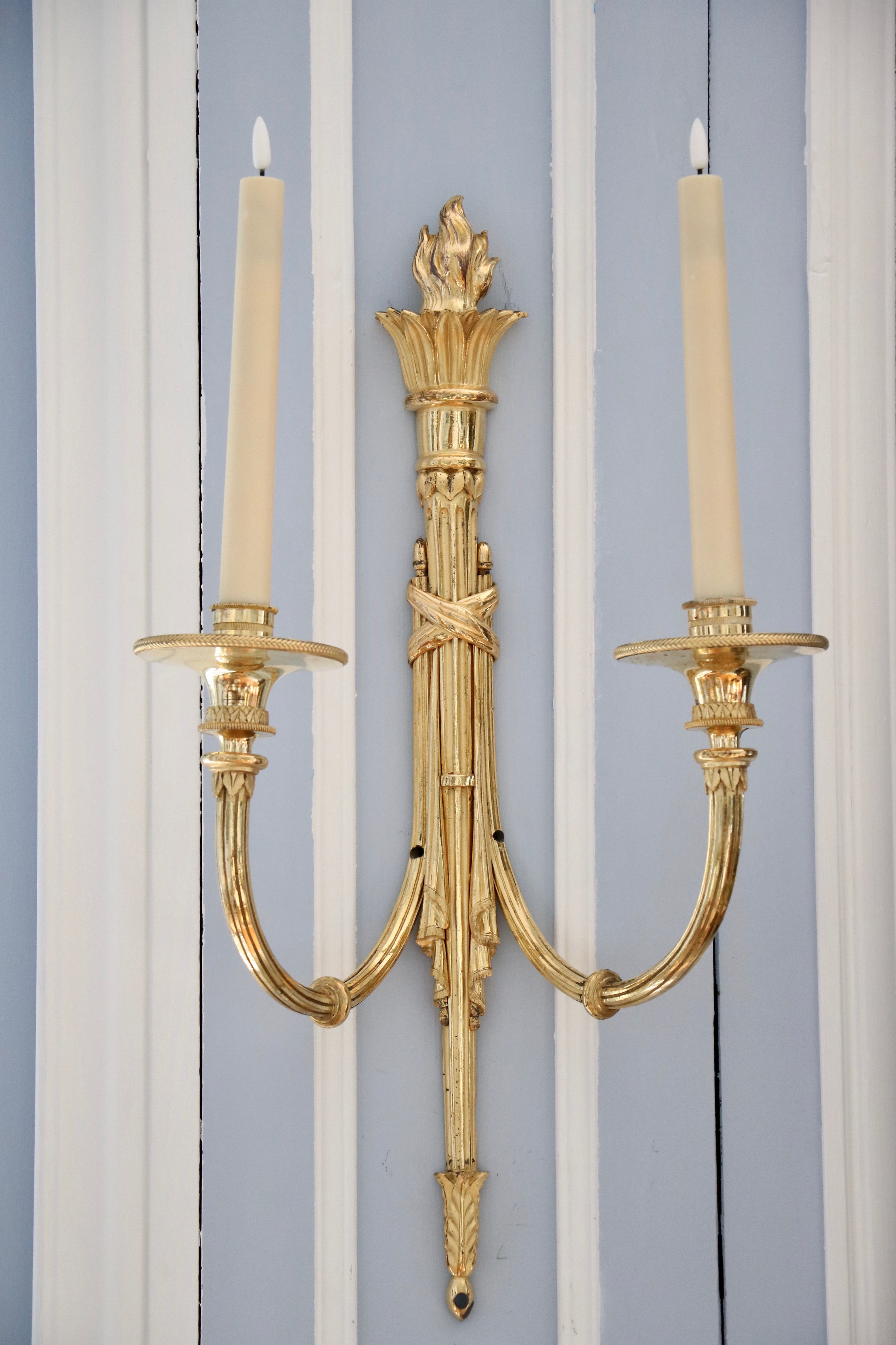 Suite de quatre appliques en bronze doré