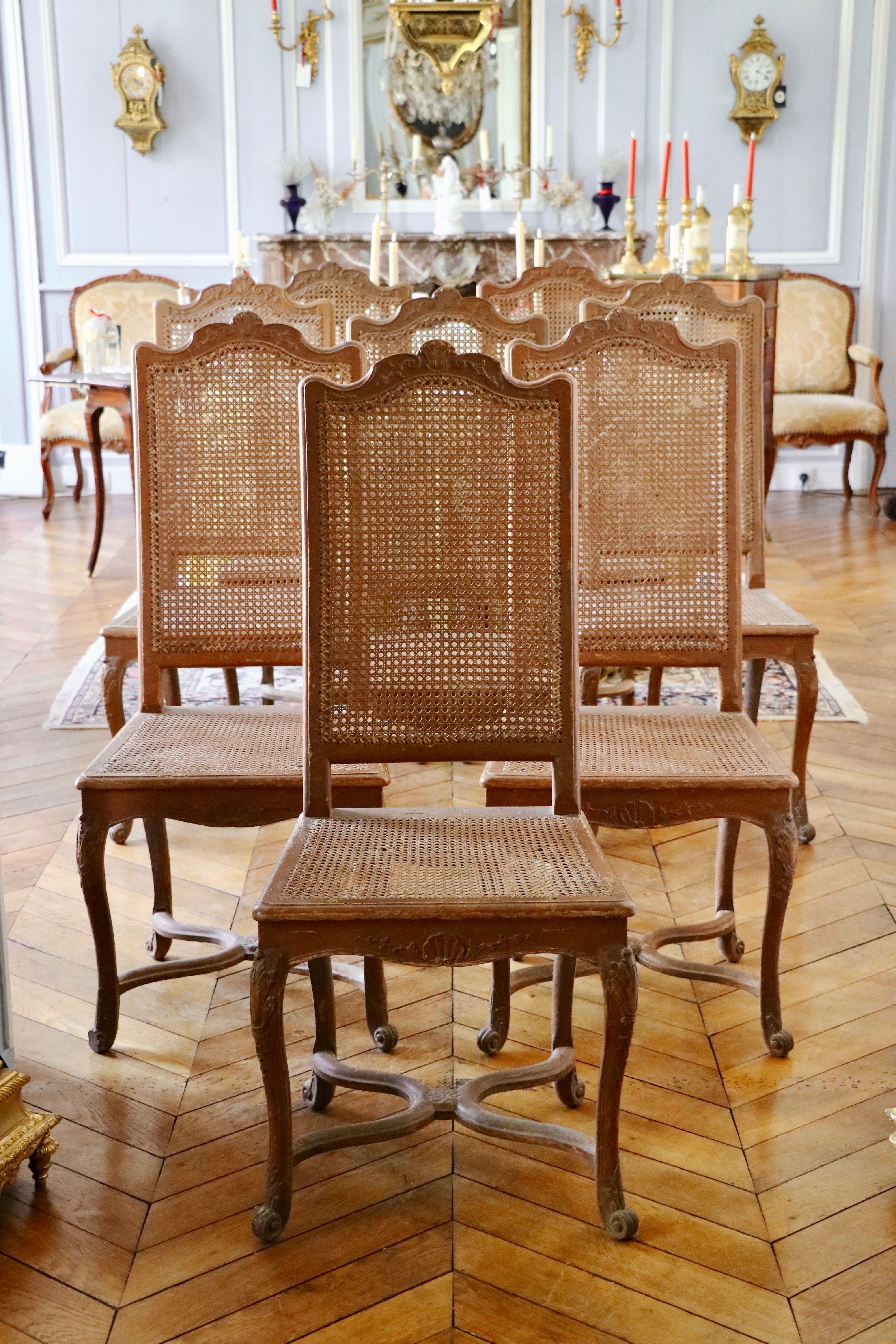 Rare ensemble de huit chaises cannées